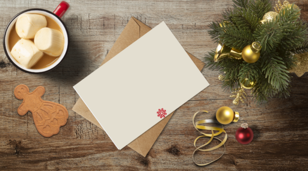 christmas themed holiday greeting card with a kraft envelope top view mockup template