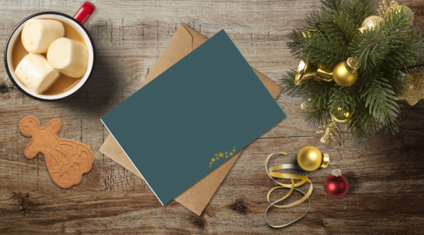 christmas themed holiday greeting card with a kraft envelope top view mockup template