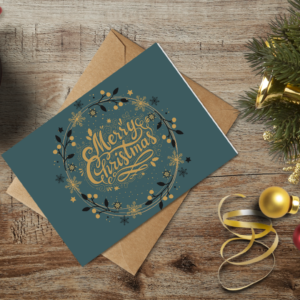 christmas themed holiday greeting card with a kraft envelope top view mockup template 6553758db738fabf2c1e9618@2x